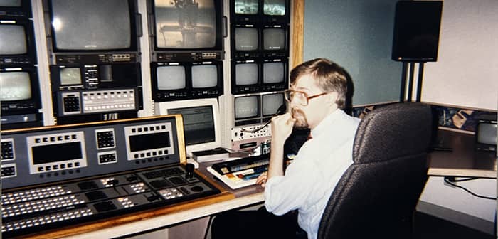 An old picture of Eric Maloney in a vintage online edit bay.