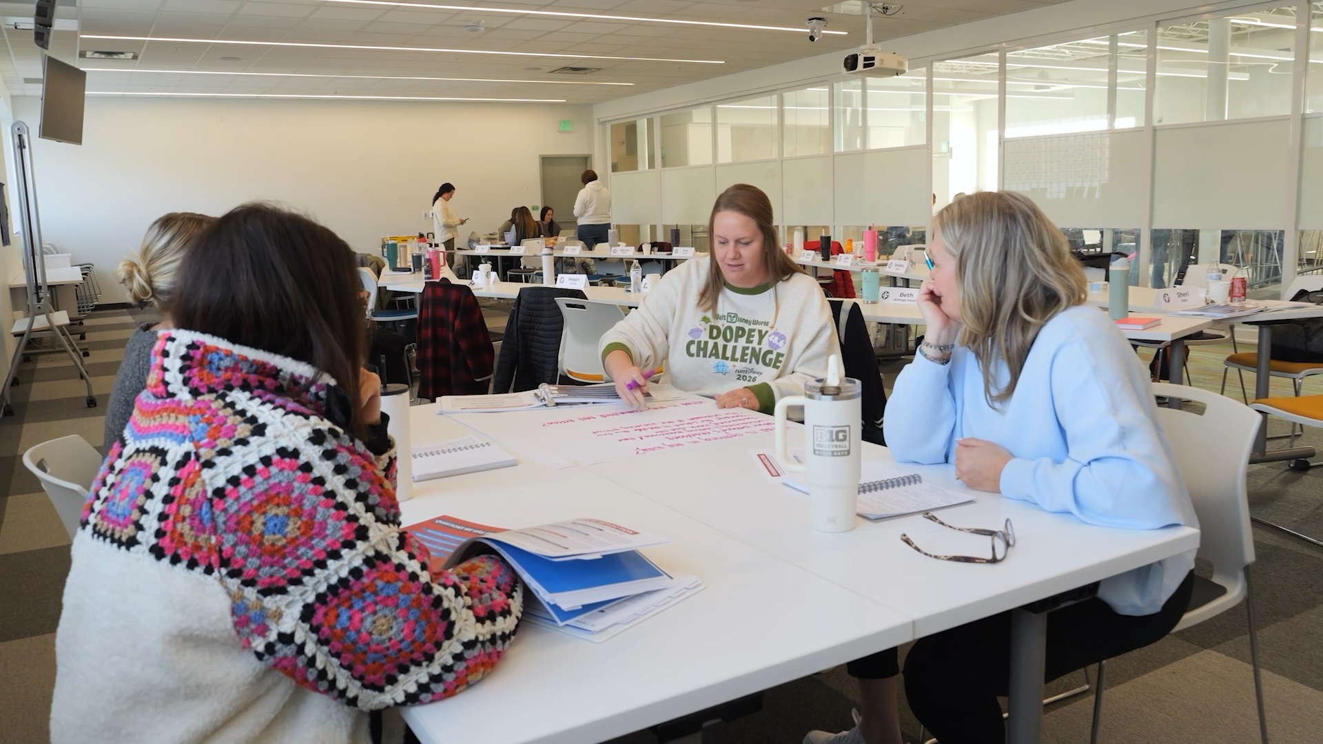 Four woman laughing in conversation